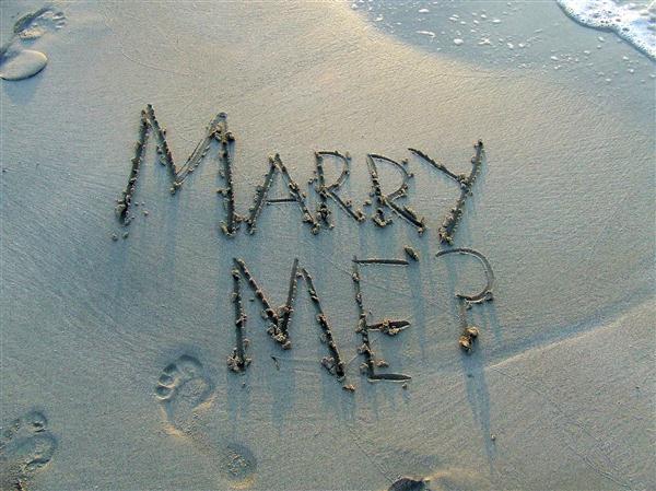 Milwaukee engagement party catering company will help you celebrate in style! Marriage proposal written in the sand